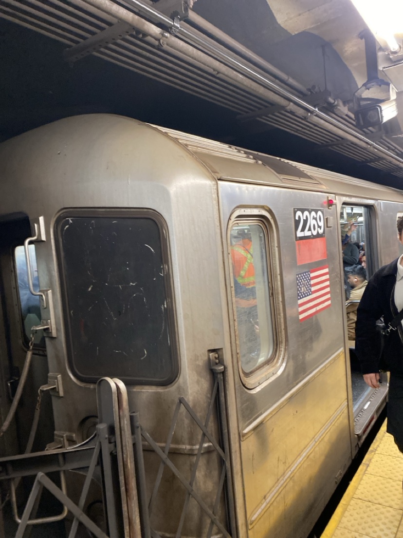 Grimy subway car 2269 with scratched windows