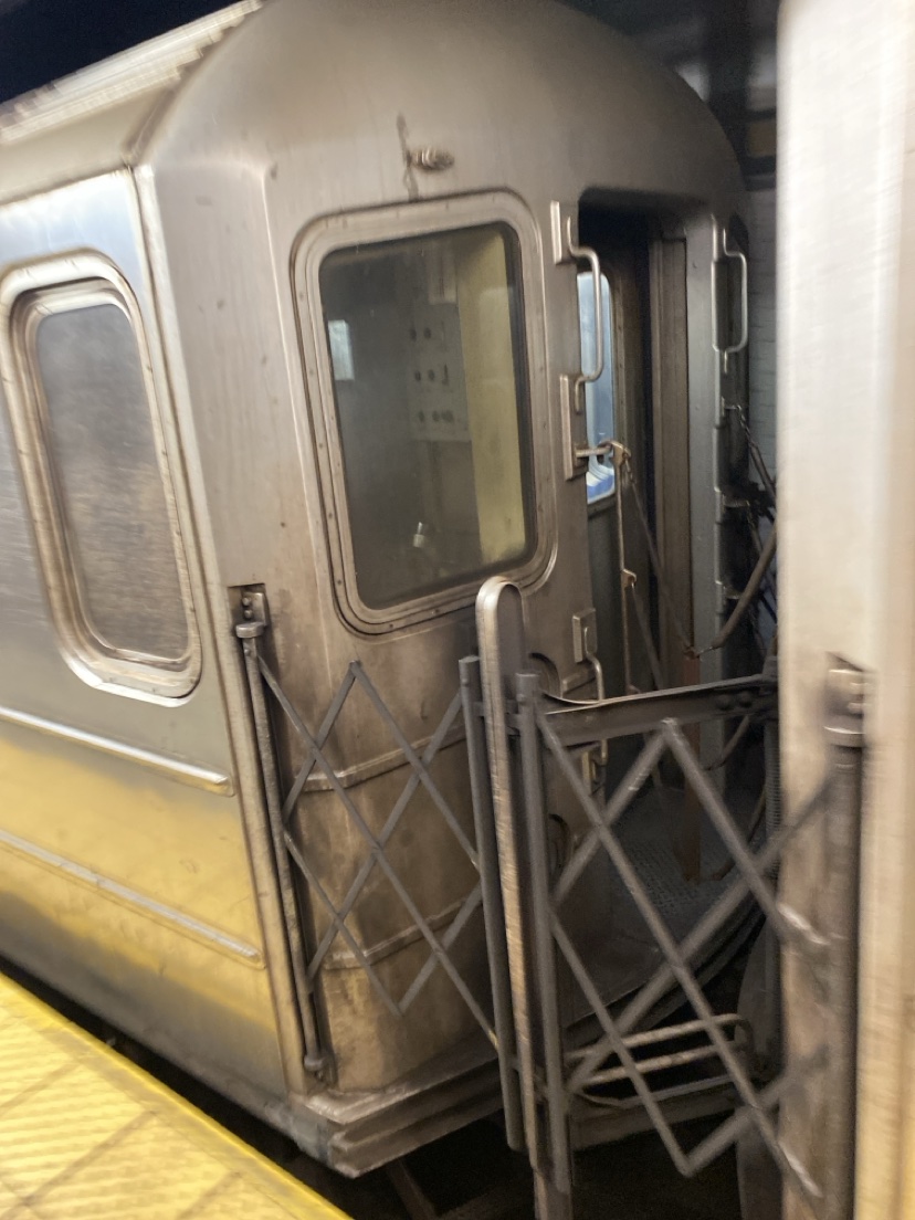 Filth caked between subway cars